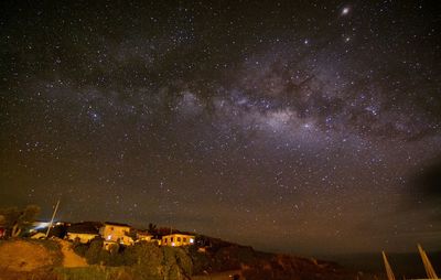 Scenic view of star field against sky at night