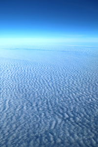 Scenic view of sea against blue sky