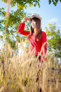 Young woman standing on field