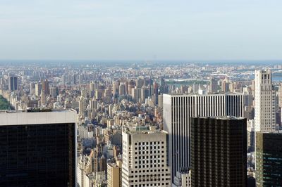 Aerial view of modern buildings in city against sky