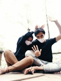 Portrait of woman sitting outdoors