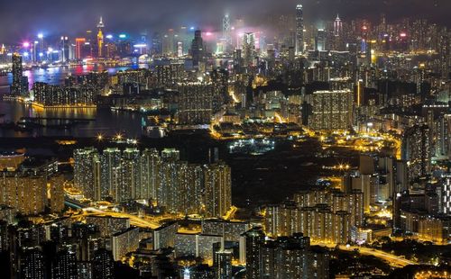 High angle view of illuminated city buildings at night