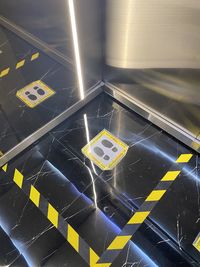 High angle view of illuminated information sign