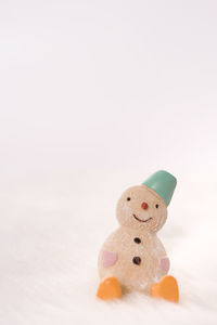 Close-up of stuffed toy against white background