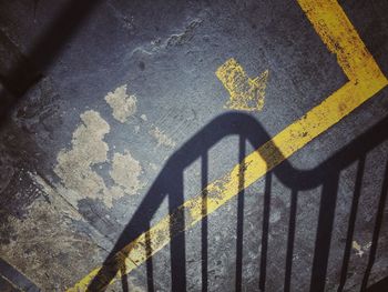 High angle view of arrow sign on road