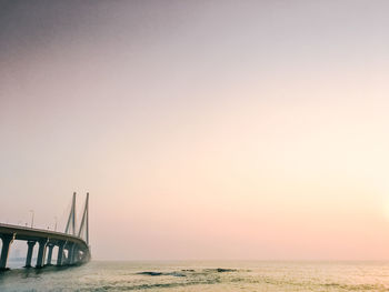 Scenic view of sea against clear sky during sunset