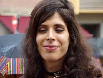 Close-up portrait of a smiling young woman