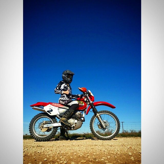 bicycle, mode of transport, transportation, land vehicle, parked, stationary, parking, clear sky, motorcycle, copy space, blue, riding, day, wheel, cycling, travel, cycle, outdoors, transfer print, sunlight