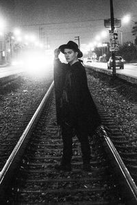 Man standing on railroad track