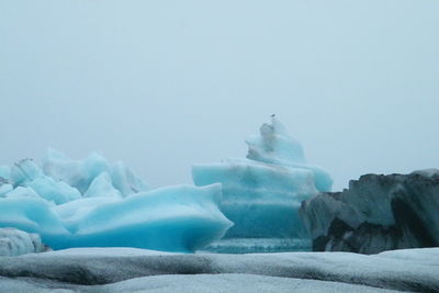 Scenic view of frozen lake against clear sky