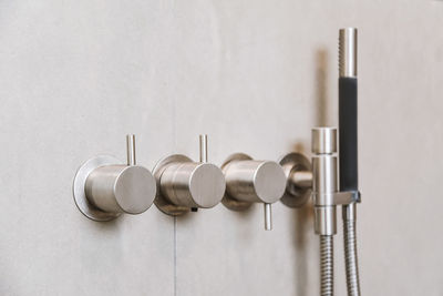 Close-up of pipes on table against white background