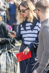 Midsection of women wearing sunglasses