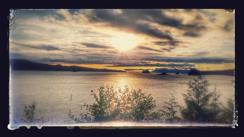 Scenic view of sea against sky at sunset