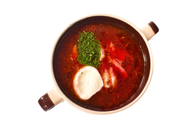 High angle view of eggs in bowl against white background