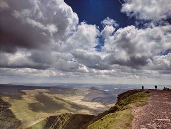 Scenic view of landscape against cloudy sky