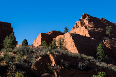 View of mountain range against clear blue sky