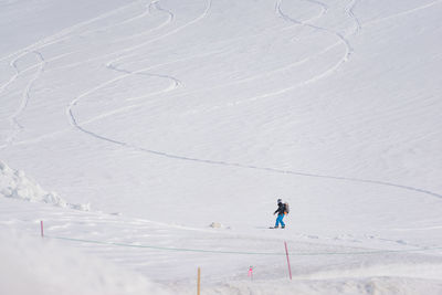 Man skiing on snowcapped mountain