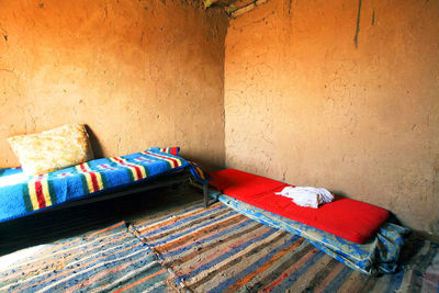 Sunlight falling in empty domestic room of mud hut