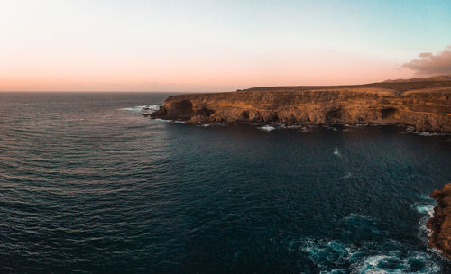 Scenic view of sea against sky at sunset