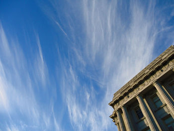 Low angle view of building against blue sky