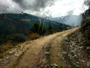 View of road against cloudy sky