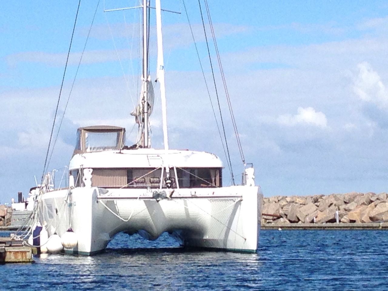 SAILBOATS MOORED ON SEA