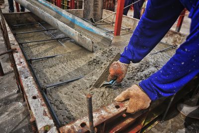 Low section of man working at construction site