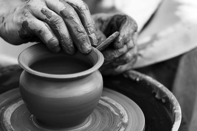 Hands of a potter. potter making ceramic pot on the pottery wheel