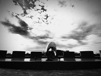 Fountain in front of golden gate bridge against sky