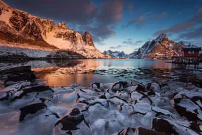 Scenic view of snowcapped mountains against sky during sunset