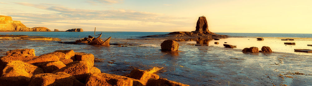 Scenic view of sea against sky during sunset