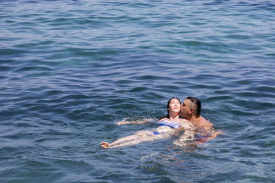 Portrait of a smiling young woman in sea