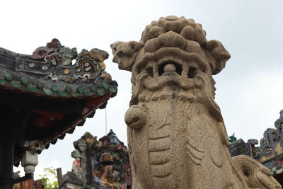 Low angle view of statue against sky