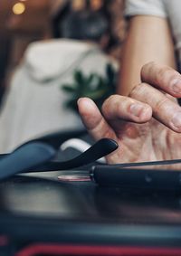 Close-up of man using mobile phone