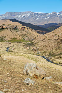 Scenic view of landscape and mountains against sky