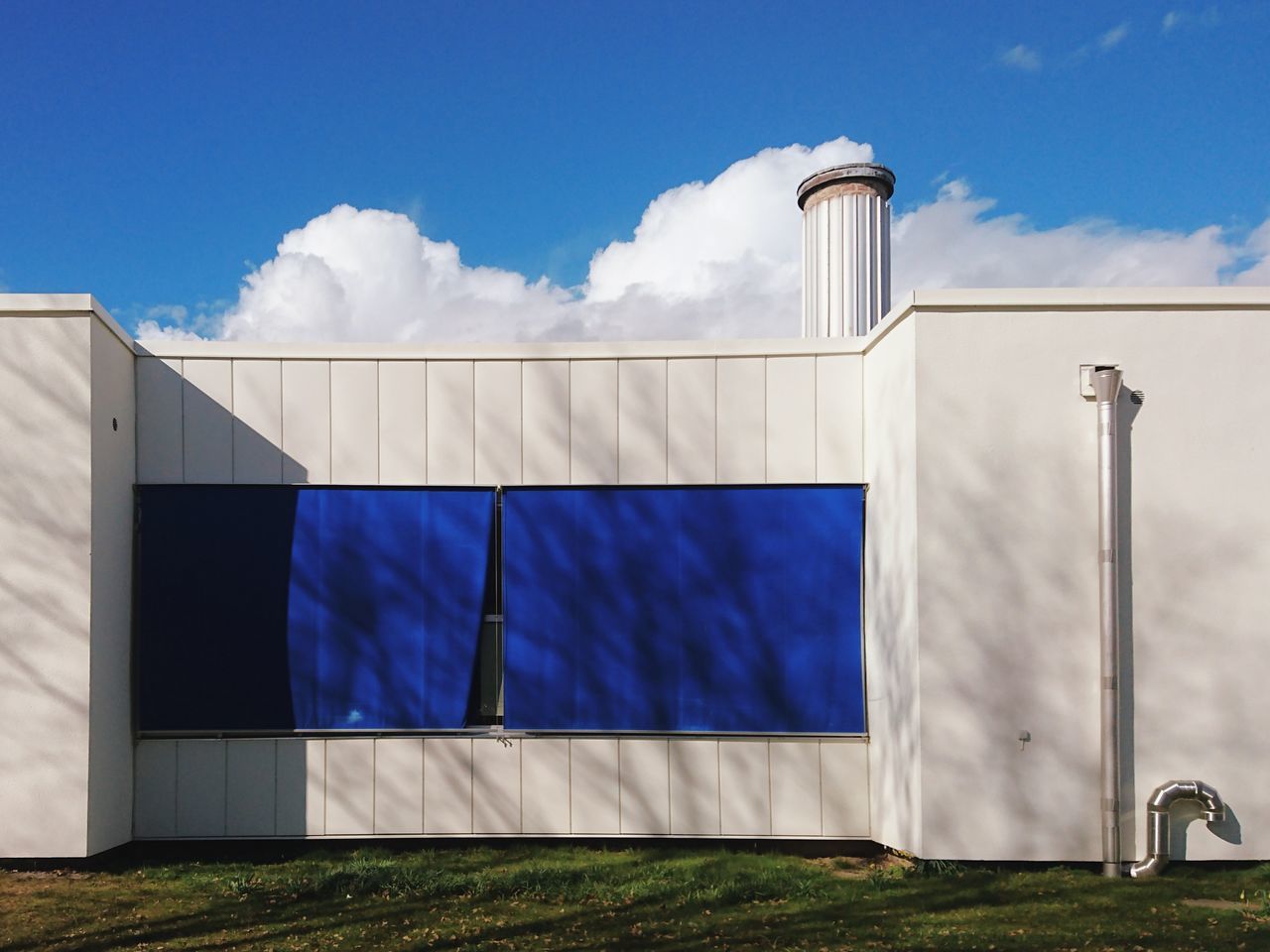 BLUE SKY OVER BUILT STRUCTURE