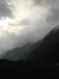 Scenic view of silhouette mountains against sky