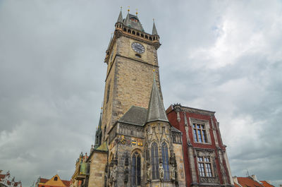 Low angle view of clock tower against sky