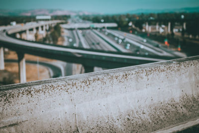 High angle view of cars on road against sky in city