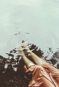 High angle view of woman swimming in lake