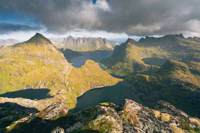 Steep mountains of lofoten island on a sunny arctic day. view from top of hermannsdalstinden peak