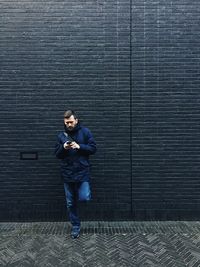 Woman walking on sidewalk