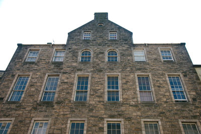 Low angle view of old building against clear sky