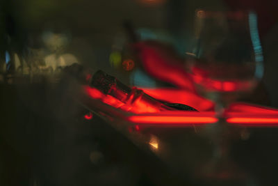 Close-up of red wine on glass table