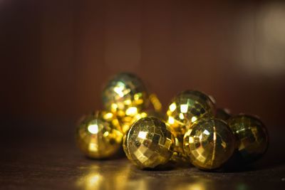 Close-up of illuminated lamp on table