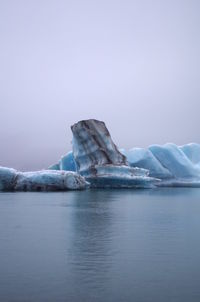 Scenic view of frozen sea against clear sky