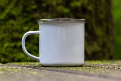 Close-up of coffee cup on table