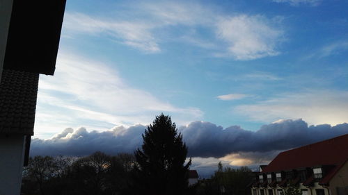 Low angle view of mountain against cloudy sky