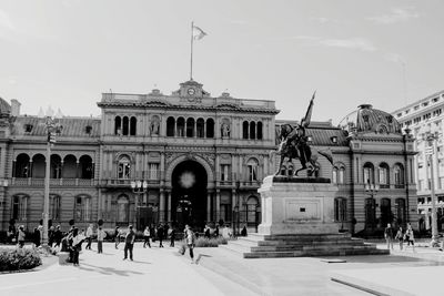 Group of people in front of historical building