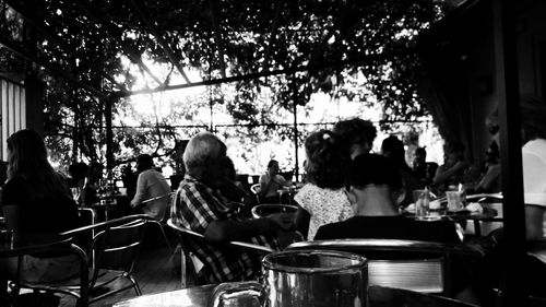 Group of people sitting on table